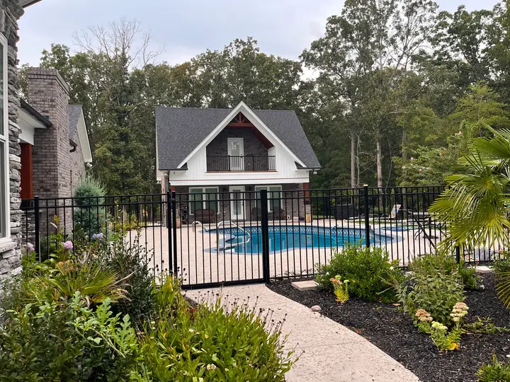 Black aluminum pool fence beside a home in Waxhaw, NC