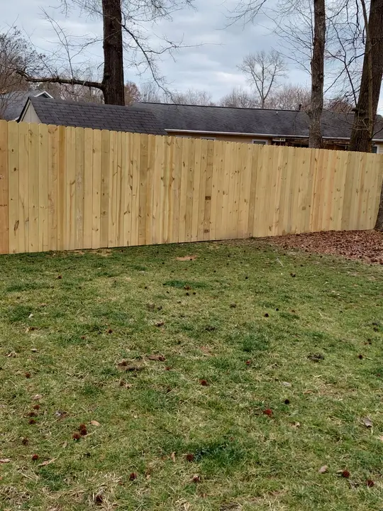 Pressure treated pine privacy fence in a backyard in Harrisburg, NC